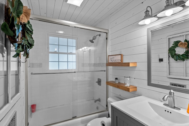 2872 Ga Highway 102, Wrens, GA 30833 - full bathroom with vanity, wood walls, toilet, and shower / bath combination with glass door