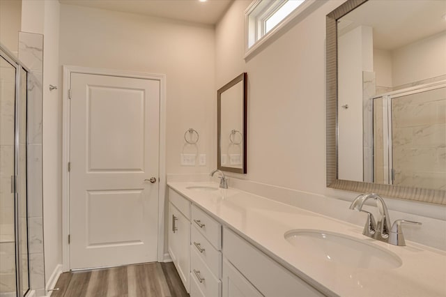 2015 Saylor Ln, Grovetown, GA 30813 - bathroom with a shower stall, double vanity, and wood finished floors