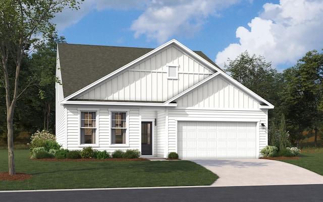 view of front of house with a front yard and a garage