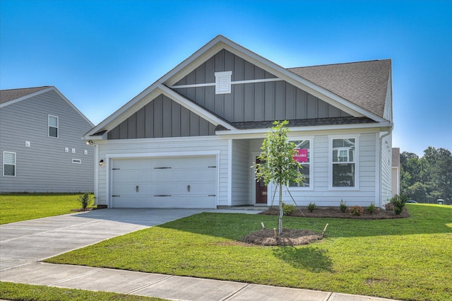 2015 Saylor Ln, Grovetown, GA 30813 - view of front facade with board and batten siding, driveway, a front yard, and roof with shingles