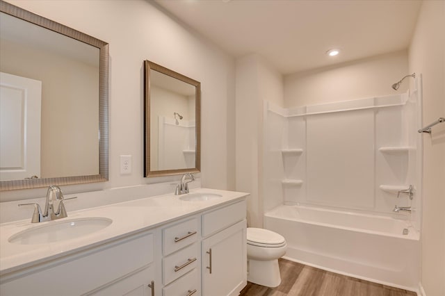 2015 Saylor Ln, Grovetown, GA 30813 - bathroom with toilet, double vanity, shower / bathtub combination, wood finished floors, and recessed lighting