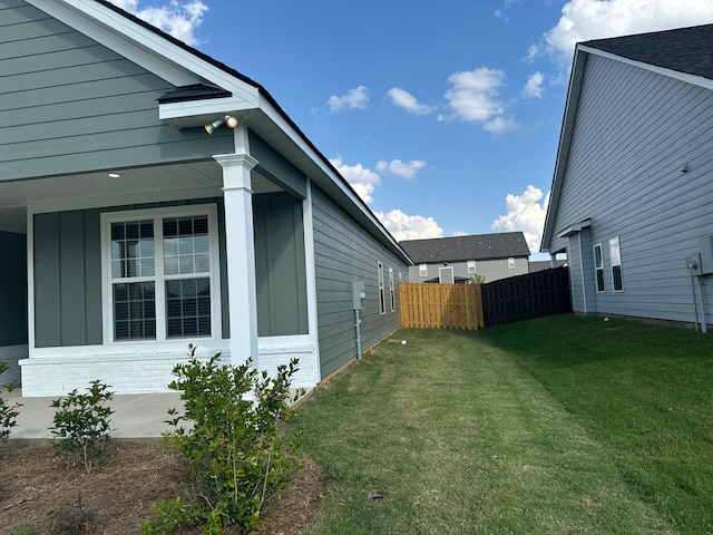 view of property exterior with a yard