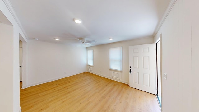 entrance foyer with light wood-type flooring, a ceiling fan, recessed lighting, baseboards, and crown molding