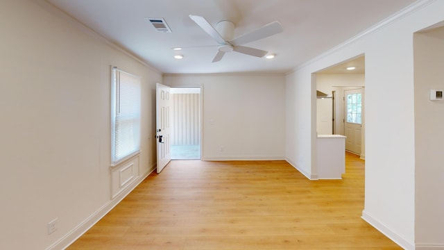 empty room with crown molding, ceiling fan, light wood-style flooring, recessed lighting, and baseboards