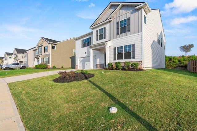 view of front of home with a garage and a front lawn