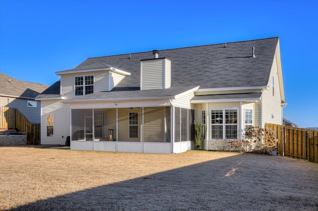 rear view of house with a sunroom