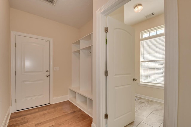 mudroom featuring plenty of natural light and light wood-type flooring