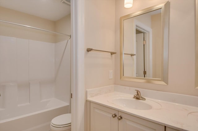 full bathroom with vanity, toilet, and washtub / shower combination