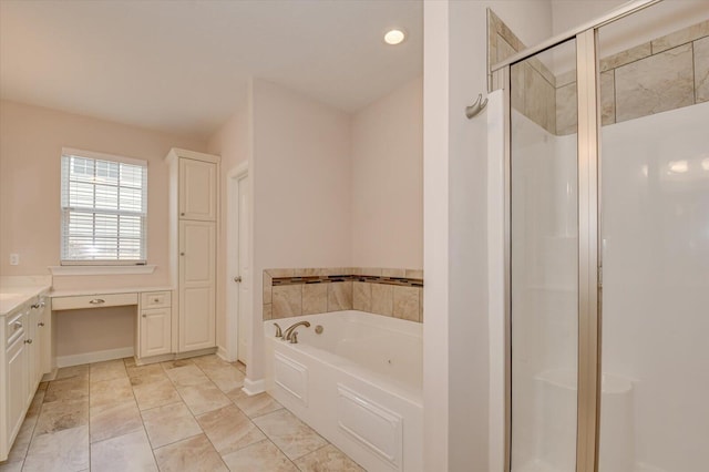 bathroom featuring vanity and shower with separate bathtub