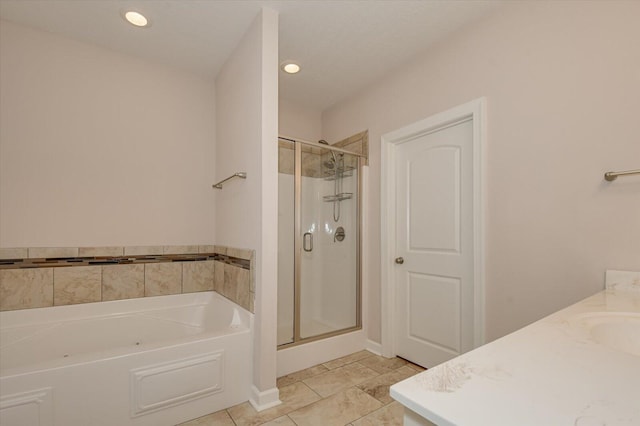 bathroom featuring vanity, tile patterned floors, and separate shower and tub