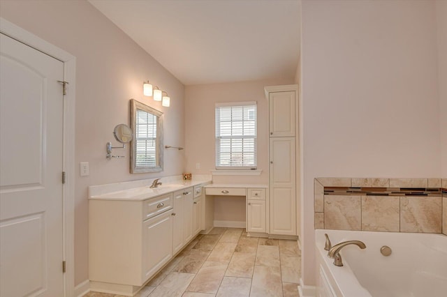 bathroom featuring vanity, a bath, and tile patterned flooring