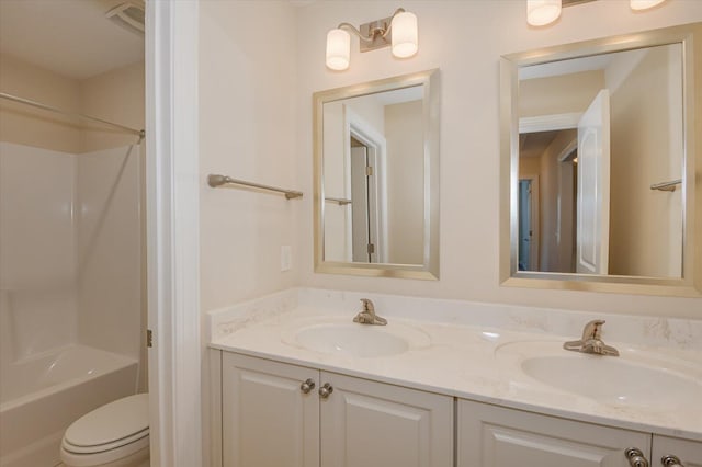 full bathroom with shower / tub combination, vanity, and toilet