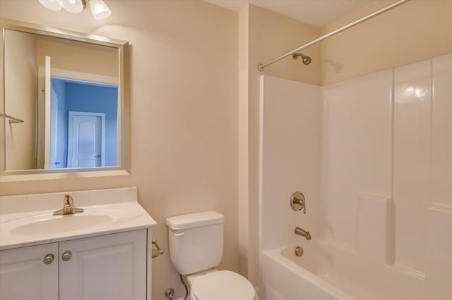 full bathroom with vanity, shower / washtub combination, and toilet