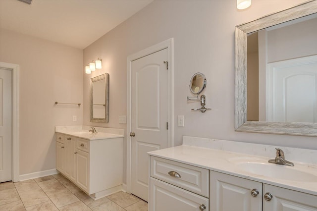 bathroom featuring tile patterned flooring and vanity