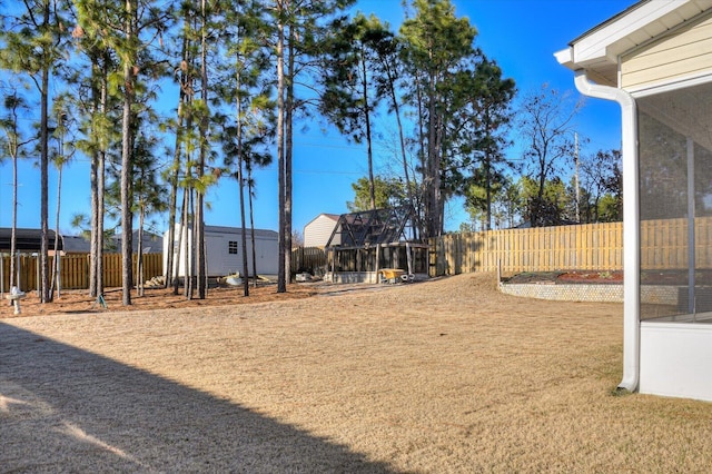 view of yard with a sunroom