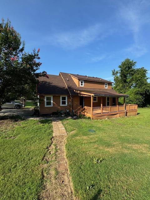 6183 Columbia Rd, Appling, GA 30802 - back of property with a wooden deck and a lawn