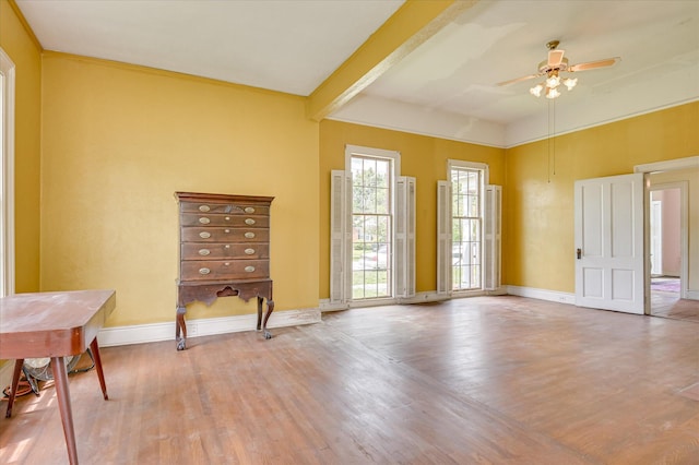 818 Academy Ave, Waynesboro, GA 30830 - spare room featuring wood finished floors, a ceiling fan, and beam ceiling