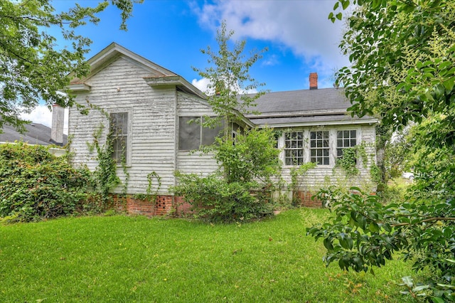 818 Academy Ave, Waynesboro, GA 30830 - view of side of property with a chimney and a yard