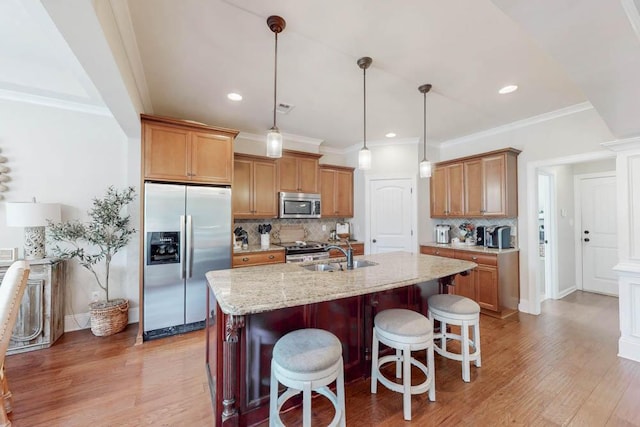 617 Morris Run, North Augusta, SC 29860 - kitchen featuring stainless steel appliances, light wood-style flooring, decorative backsplash, a breakfast bar area, and a sink