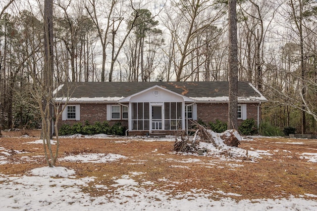 view of front facade with a sunroom