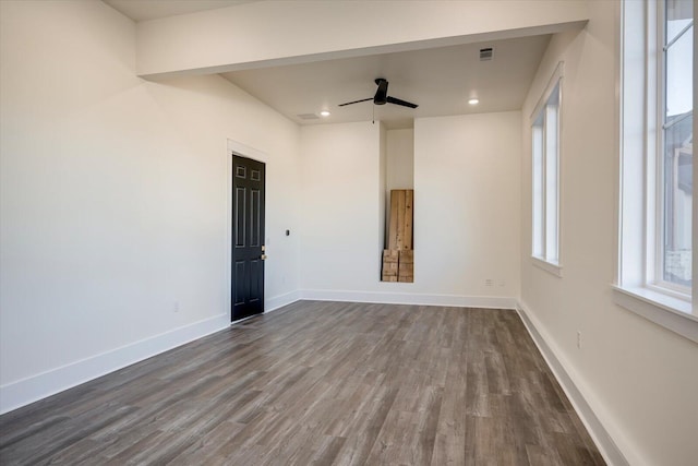 empty room featuring hardwood / wood-style floors and ceiling fan