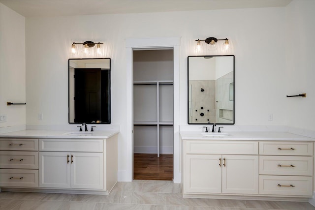 bathroom with a shower and vanity