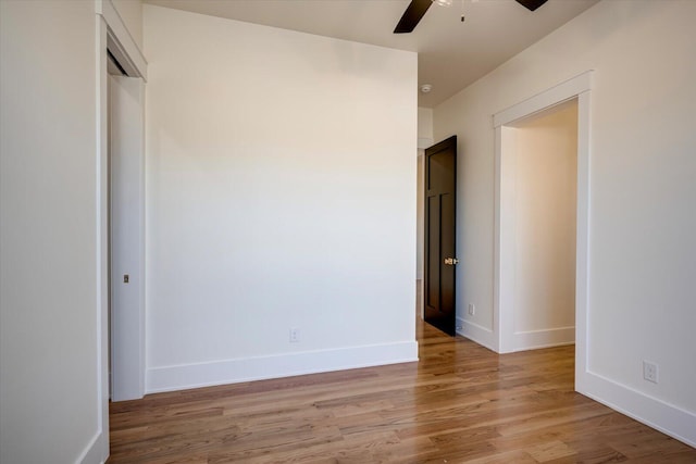 unfurnished bedroom featuring ceiling fan and light hardwood / wood-style flooring