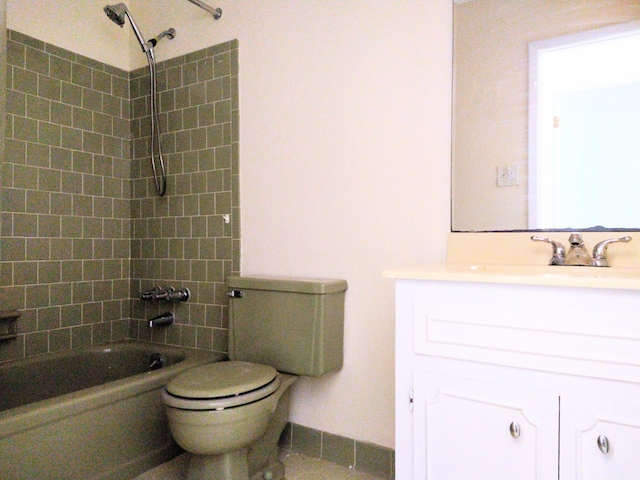 bathroom with toilet, vanity, bathtub / shower combination, tile patterned floors, and baseboards