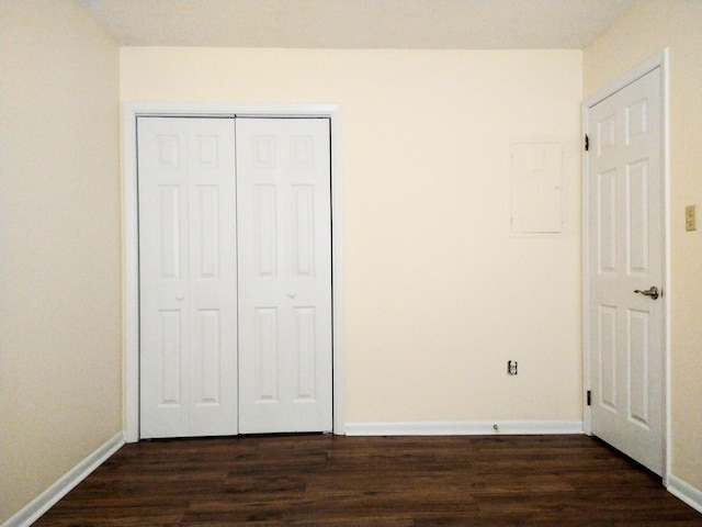 3959 Braddock St, Martinez, GA 30907 - unfurnished bedroom with dark wood finished floors, a closet, and electric panel