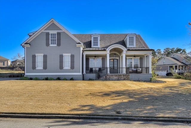 view of front facade featuring ceiling fan, a porch, and a front lawn