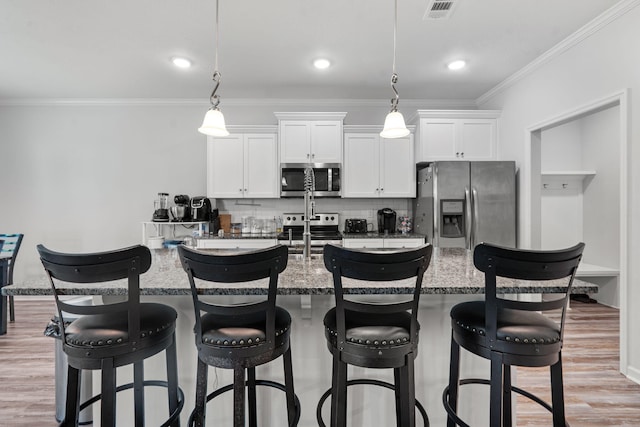 120 Dublin Loop, Grovetown, GA 30813 - kitchen with stainless steel appliances, crown molding, white cabinetry, backsplash, and a center island with sink