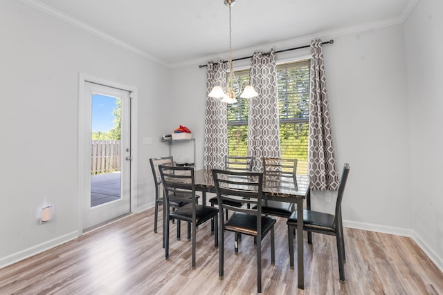 120 Dublin Loop, Grovetown, GA 30813 - dining room with wood finished floors, a chandelier, and ornamental molding