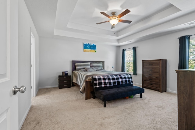 120 Dublin Loop, Grovetown, GA 30813 - carpeted bedroom featuring a tray ceiling, multiple windows, and a ceiling fan