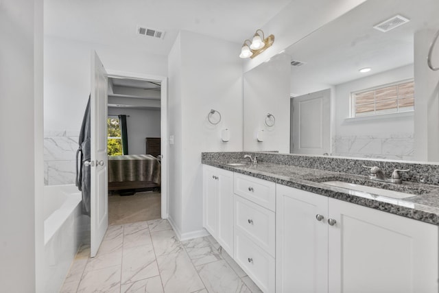 120 Dublin Loop, Grovetown, GA 30813 - ensuite bathroom with double vanity, marble finish floors, and a bath