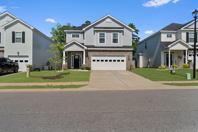 120 Dublin Loop, Grovetown, GA 30813 - view of front of home featuring an attached garage, brick siding, concrete driveway, and a front yard