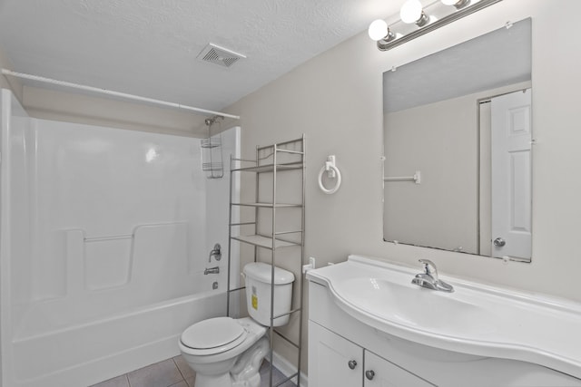 full bathroom with toilet, shower / tub combination, tile patterned floors, a textured ceiling, and vanity