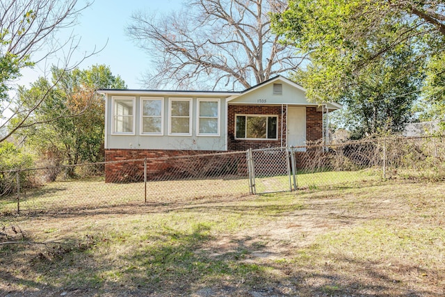 view of front of home with a front lawn