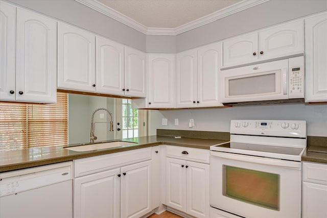 160 Crescent Dr, Mccormick, SC 29835 - kitchen with white appliances, a sink, dark countertops, crown molding, and white cabinetry