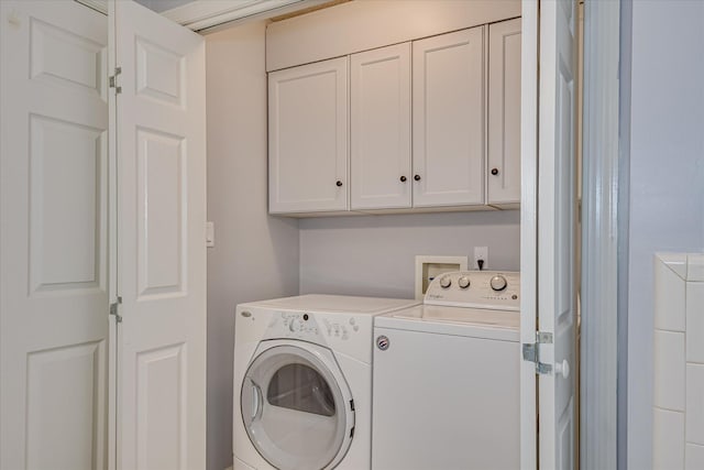 160 Crescent Dr, Mccormick, SC 29835 - washroom featuring separate washer and dryer and cabinet space