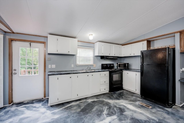 kitchen with black appliances, white cabinets, and a wealth of natural light