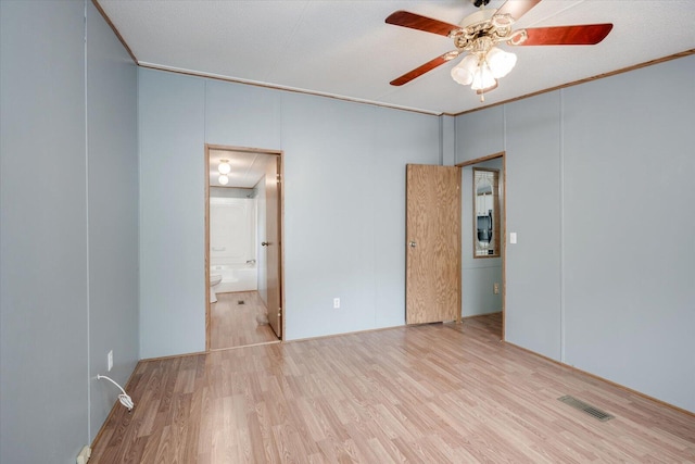 empty room featuring ceiling fan, light hardwood / wood-style floors, ornamental molding, and a textured ceiling