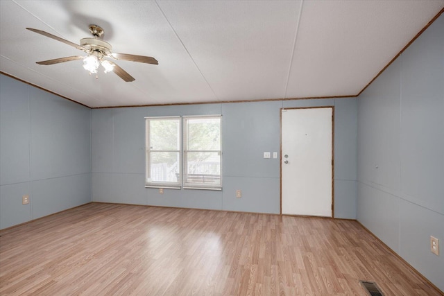 spare room with ceiling fan and light hardwood / wood-style flooring