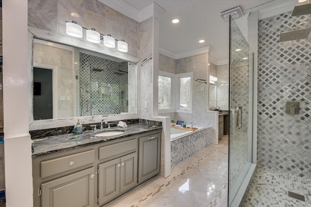 4512 Hardy Mcmanus Rd, Evans, GA 30809 - full bath featuring vanity, crown molding, tile walls, a stall shower, and a garden tub