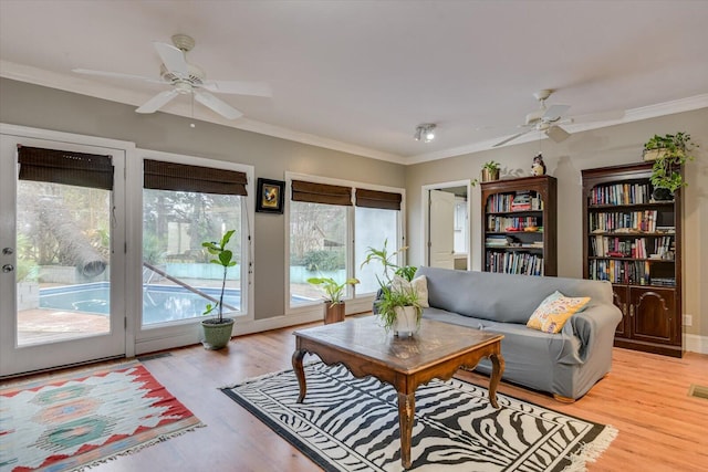 4512 Hardy Mcmanus Rd, Evans, GA 30809 - living room featuring a ceiling fan, ornamental molding, and light wood-type flooring