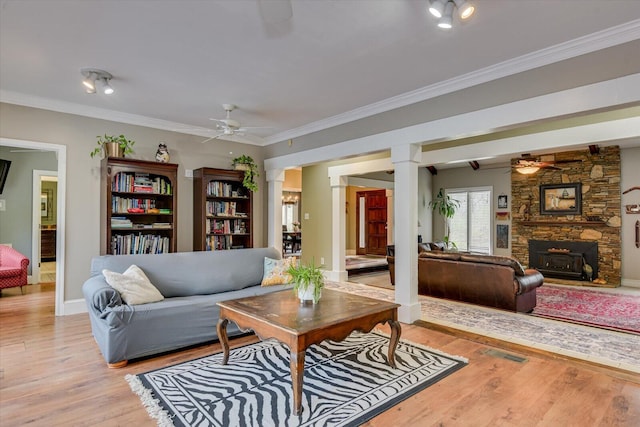 4512 Hardy Mcmanus Rd, Evans, GA 30809 - living room with light wood-type flooring, ornate columns, and a ceiling fan