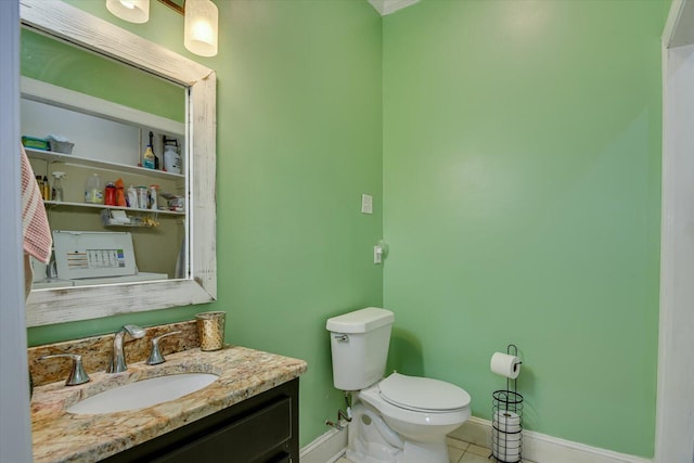 4512 Hardy Mcmanus Rd, Evans, GA 30809 - bathroom with baseboards, toilet, tile patterned floors, and vanity