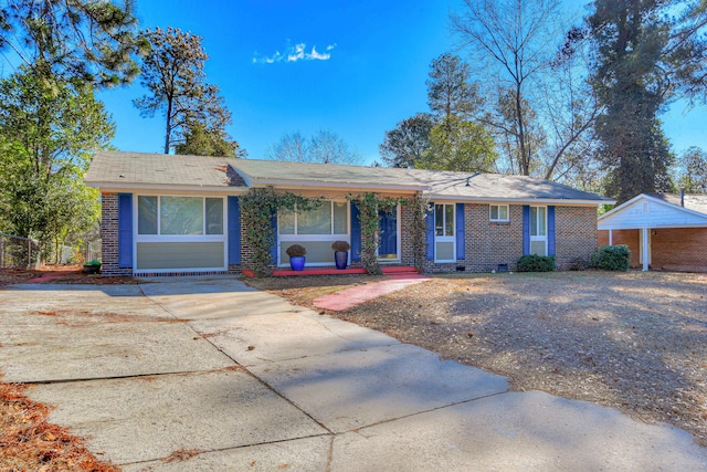 ranch-style house with a carport