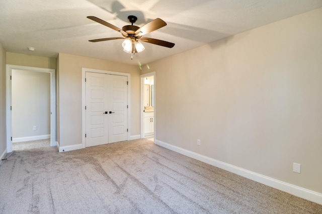 unfurnished bedroom featuring baseboards, carpet floors, and ceiling fan