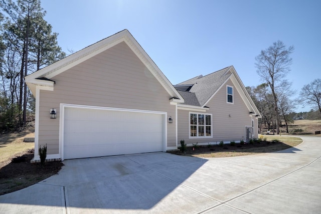 view of property exterior with driveway and a garage