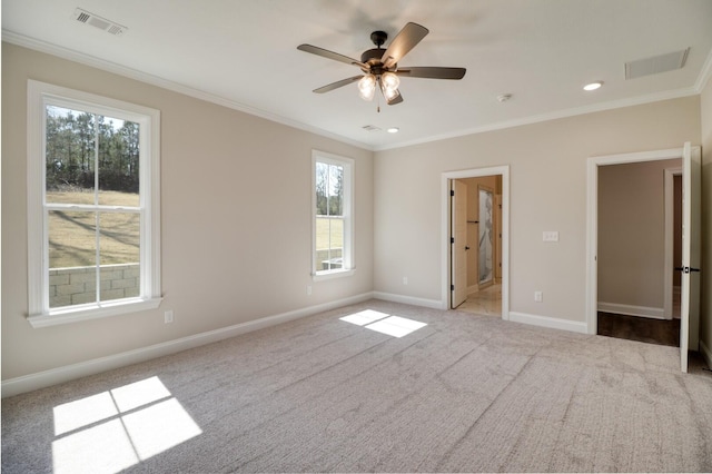 unfurnished bedroom with visible vents, baseboards, carpet, and ornamental molding